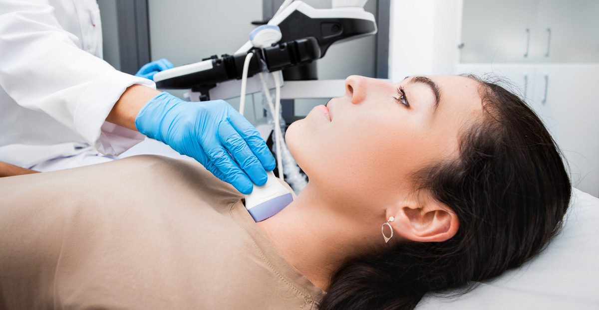 Woman-undergoing-ultrasound-for-thyroid-tumors